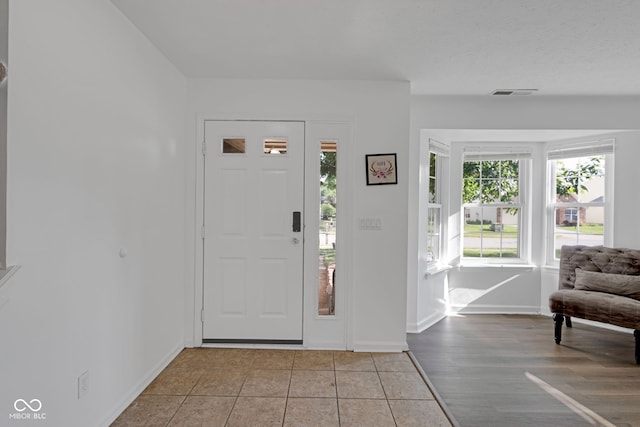 8850 Tanner Dr, Fishers, IN 46038 - entryway with baseboards and light tile patterned flooring
