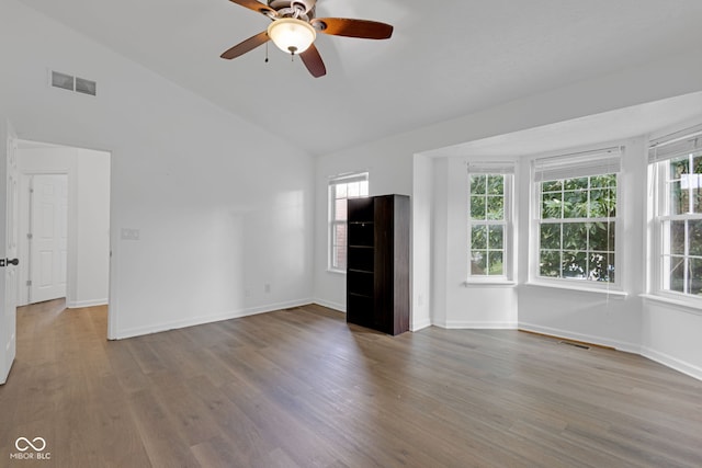 8850 Tanner Dr, Fishers, IN 46038 - unfurnished living room with wood finished floors, ceiling fan, and high vaulted ceiling