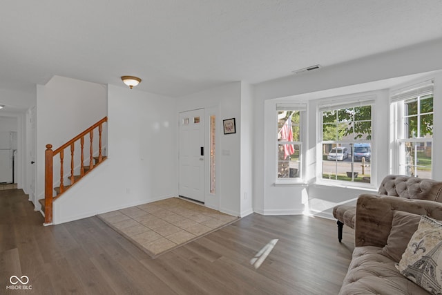 8850 Tanner Dr, Fishers, IN 46038 - foyer entrance featuring wood finished floors and stairs