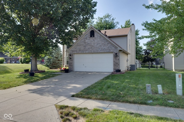8850 Tanner Dr, Fishers, IN 46038 - view of side of home with a chimney, a garage, a yard, concrete driveway, and brick siding