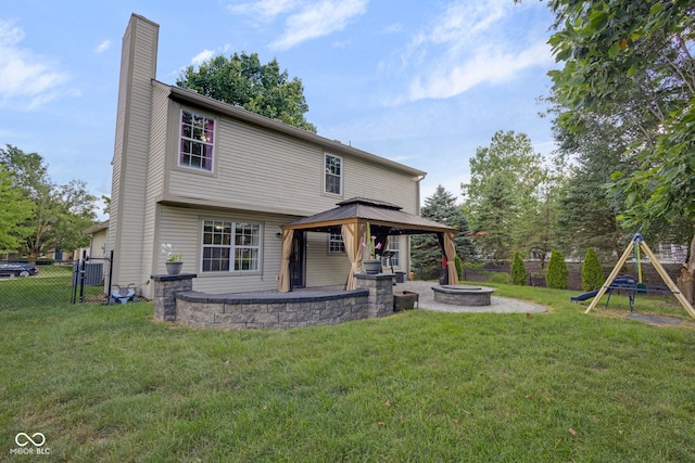 8850 Tanner Dr, Fishers, IN 46038 - rear view of property with a gazebo, a fire pit, a chimney, a patio, and a gate