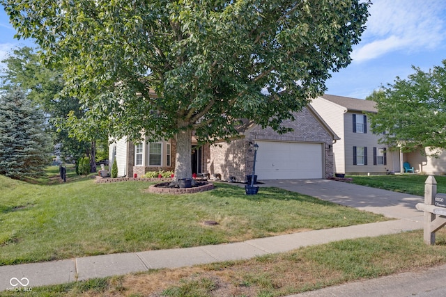 8850 Tanner Dr, Fishers, IN 46038 - view of front facade with an attached garage, concrete driveway, a front yard, and brick siding