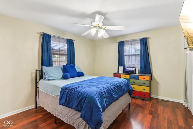 121 Apple St, Greenfield, IN 46140 - bedroom featuring multiple windows, wood finished floors, and a ceiling fan