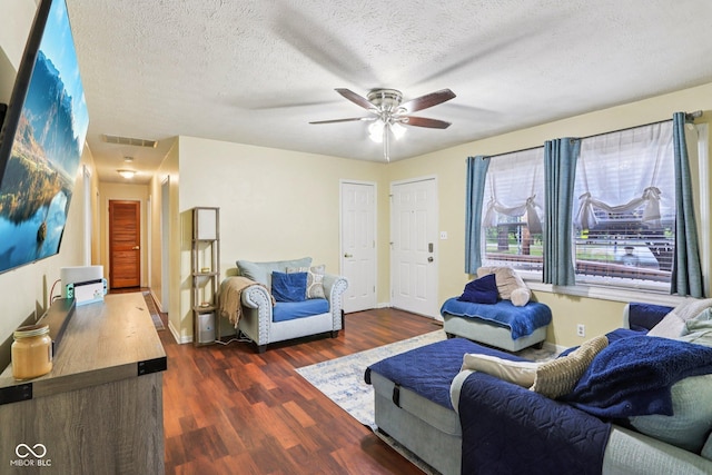 121 Apple St, Greenfield, IN 46140 - living area with dark wood-style flooring, ceiling fan, and a textured ceiling
