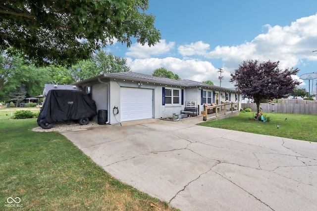 121 Apple St, Greenfield, IN 46140 - single story home with an attached garage, brick siding, and driveway
