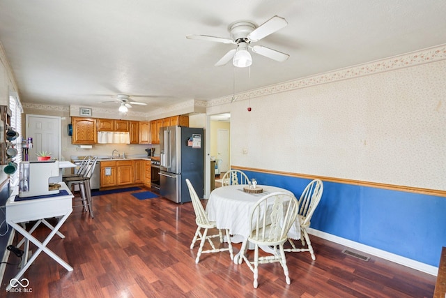 121 Apple St, Greenfield, IN 46140 - dining room featuring ceiling fan, dark wood-type flooring, and wallpapered walls