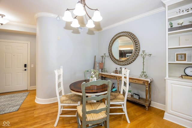 20971 Shoreline Ct Unit 408, Noblesville, IN 46062 - dining room with a chandelier, ornamental molding, and light wood-style floors