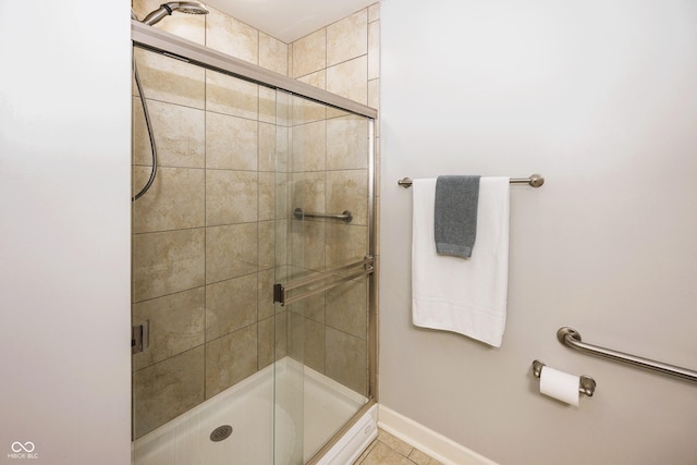 20971 Shoreline Ct Unit 408, Noblesville, IN 46062 - full bathroom featuring a stall shower and tile patterned flooring