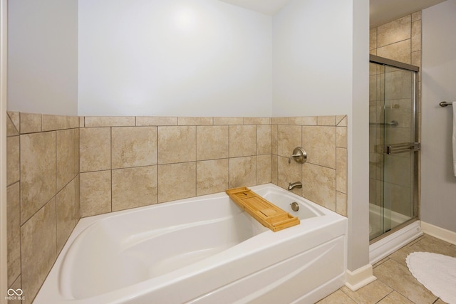 20971 Shoreline Ct Unit 408, Noblesville, IN 46062 - full bathroom featuring a garden tub, a shower stall, and tile patterned floors