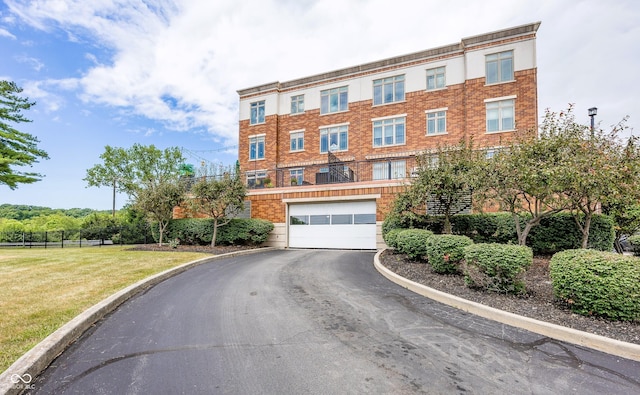 20971 Shoreline Ct Unit 408, Noblesville, IN 46062 - view of building exterior featuring driveway and a garage