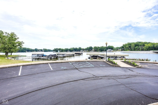20971 Shoreline Ct Unit 408, Noblesville, IN 46062 - uncovered parking lot with a water view and a dock