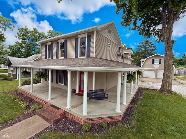 416 6th St, Covington, IN 47932 - rear view of property with covered porch, a yard, an outbuilding, and a detached garage