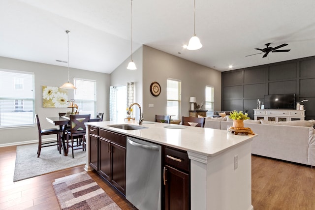 9801 Zion Way, Pendleton, IN 46064 - kitchen featuring stainless steel dishwasher, open floor plan, light countertops, wood finished floors, and vaulted ceiling