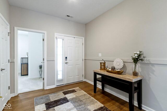 9801 Zion Way, Pendleton, IN 46064 - foyer entrance with dark wood-type flooring and baseboards