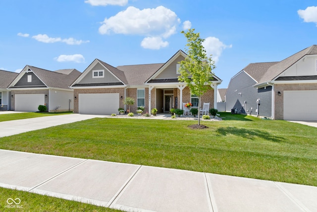 9801 Zion Way, Pendleton, IN 46064 - craftsman house featuring brick siding, concrete driveway, a front yard, and board and batten siding