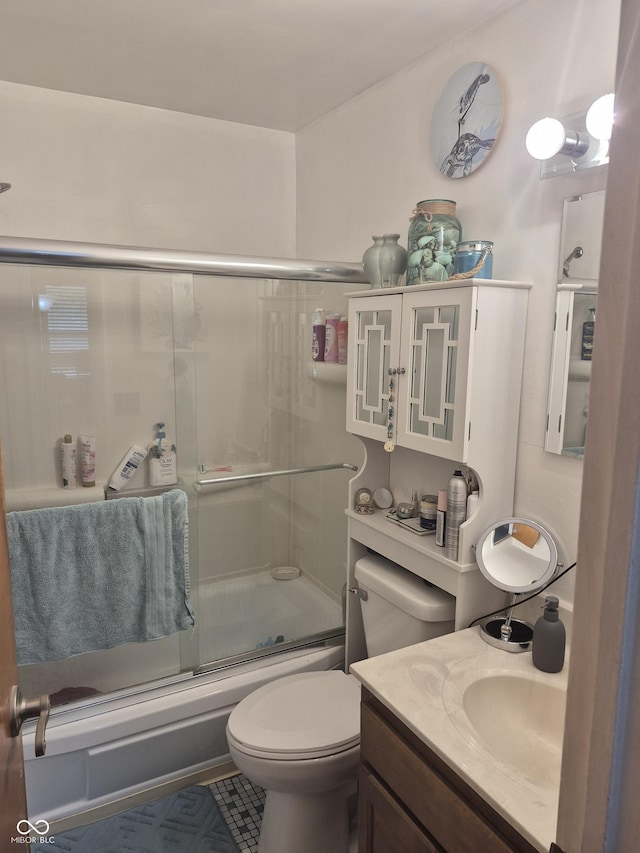 7802 Fall Creek Rd, Indianapolis, IN 46256 - bathroom featuring combined bath / shower with glass door, vanity, and tile patterned flooring
