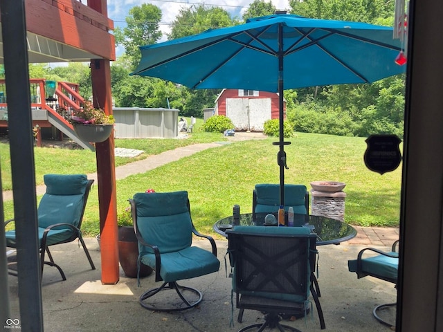 7802 Fall Creek Rd, Indianapolis, IN 46256 - view of patio / terrace with a playground, outdoor dining area, and an outbuilding