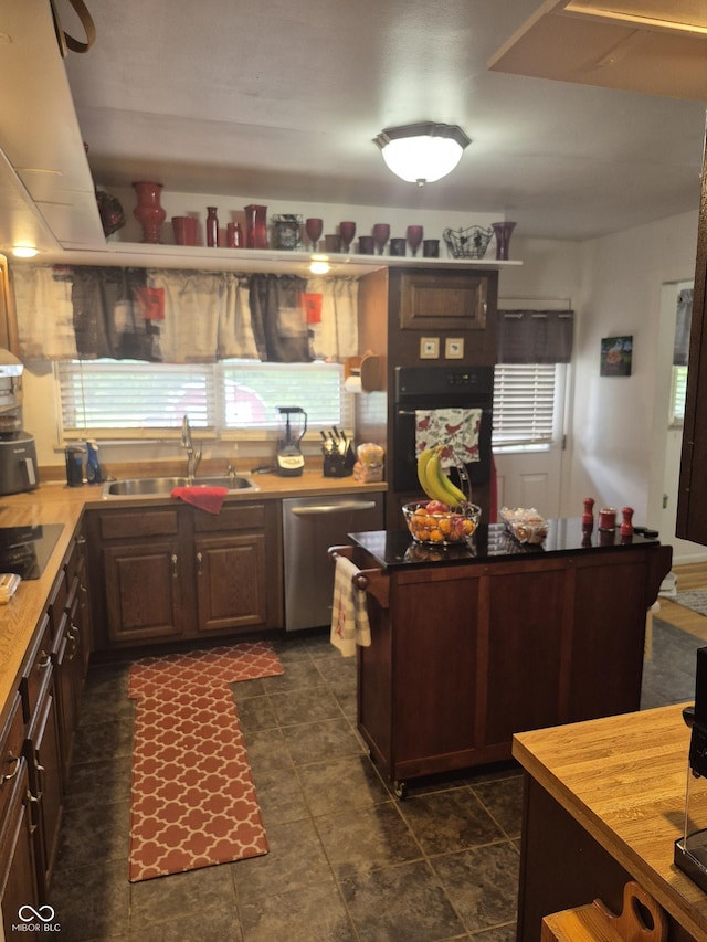 7802 Fall Creek Rd, Indianapolis, IN 46256 - kitchen featuring black appliances and wood counters