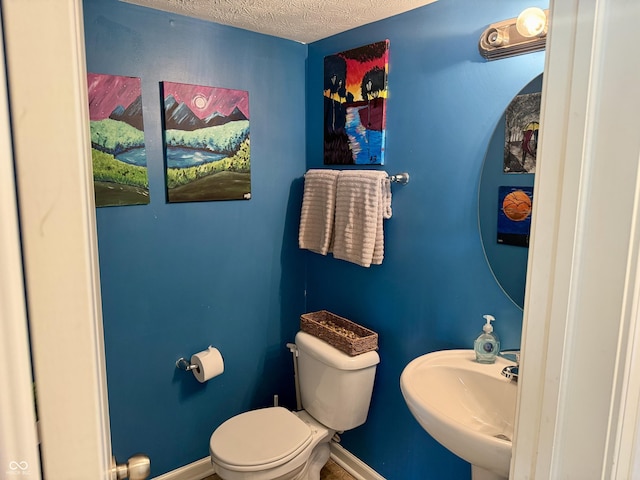 5020 Long Iron Dr, Indianapolis, IN 46235 - half bath featuring toilet and a textured ceiling