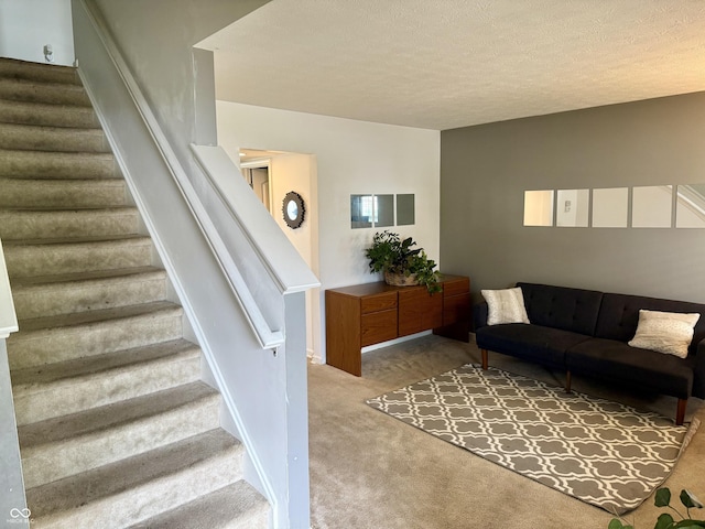 5020 Long Iron Dr, Indianapolis, IN 46235 - living room featuring stairway, carpet, and a textured ceiling