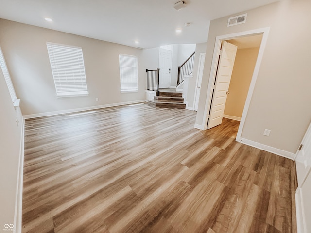 3522 Brampton Ln, Westfield, IN 46074 - spare room featuring stairs, light wood-style flooring, and recessed lighting