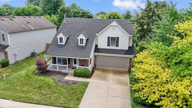 5034 Aspen Crest Ln, Indianapolis, IN 46254 - traditional home featuring covered porch, brick siding, a garage, and a front lawn