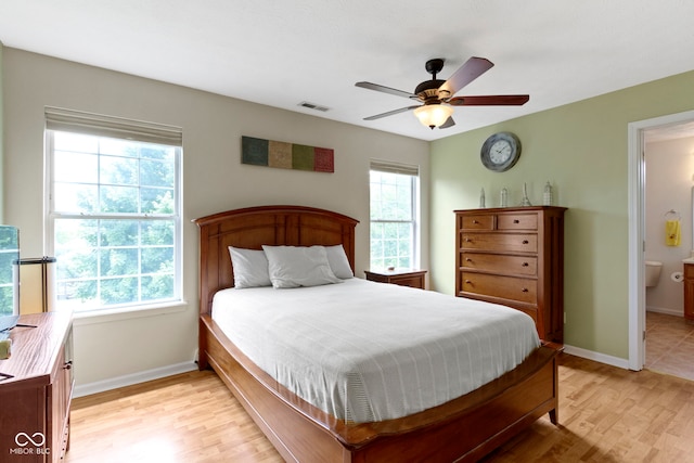 5034 Aspen Crest Ln, Indianapolis, IN 46254 - bedroom with light wood-style flooring, ensuite bath, and ceiling fan