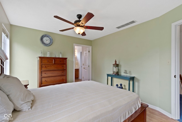 5034 Aspen Crest Ln, Indianapolis, IN 46254 - bedroom featuring wood finished floors, ceiling fan, and ensuite bath