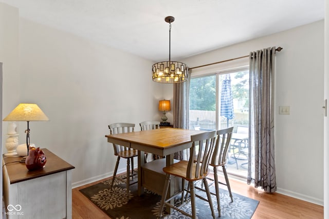 5034 Aspen Crest Ln, Indianapolis, IN 46254 - dining space with a chandelier and light wood-style flooring