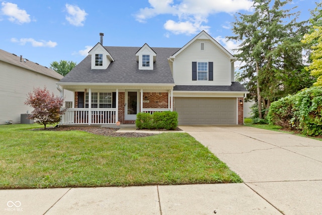 5034 Aspen Crest Ln, Indianapolis, IN 46254 - view of front of house featuring brick siding, a porch, an attached garage, concrete driveway, and a front yard