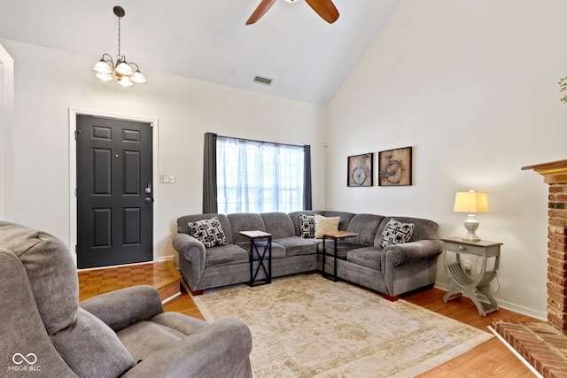 5034 Aspen Crest Ln, Indianapolis, IN 46254 - living room with high vaulted ceiling, ceiling fan, a chandelier, and wood finished floors