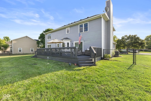 10532 Beacon Ln, Indianapolis, IN 46256 - back of house featuring a chimney, a fenced backyard, and a wooden deck