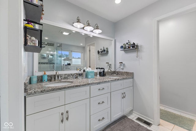 10532 Beacon Ln, Indianapolis, IN 46256 - bathroom featuring a stall shower, double vanity, tile patterned floors, and recessed lighting