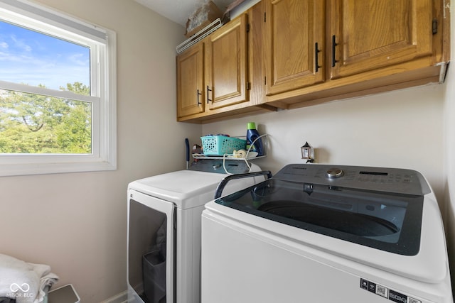 10532 Beacon Ln, Indianapolis, IN 46256 - laundry room featuring cabinet space and separate washer and dryer