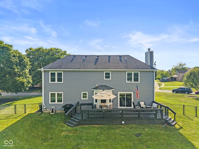 10532 Beacon Ln, Indianapolis, IN 46256 - back of property with a chimney, a wooden deck, a fenced backyard, and a gate