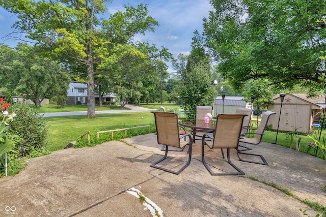 157 E Hill Valley Dr, Indianapolis, IN 46227 - view of patio with a storage shed and outdoor dining space