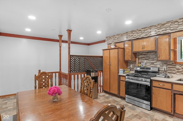 157 E Hill Valley Dr, Indianapolis, IN 46227 - kitchen with stainless steel range with gas stovetop, crown molding, light countertops, backsplash, and recessed lighting