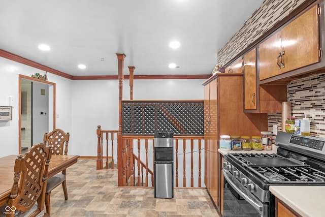 157 E Hill Valley Dr, Indianapolis, IN 46227 - kitchen with stainless steel gas range, crown molding, brown cabinetry, light countertops, and recessed lighting