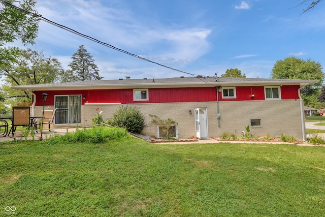 157 E Hill Valley Dr, Indianapolis, IN 46227 - rear view of property with brick siding, a lawn, and a patio