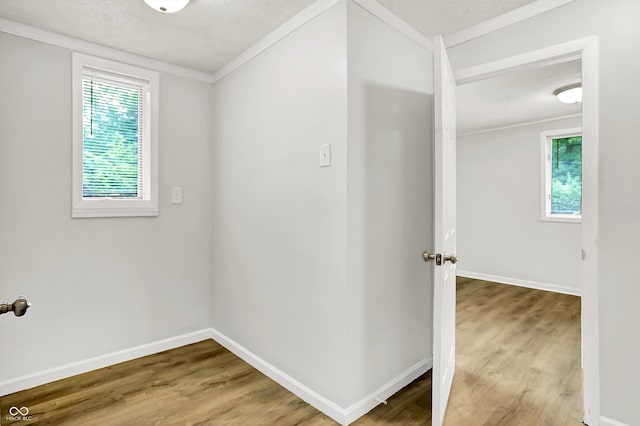 1065 Chevy Chase Ln, Carmel, IN 46280 - hallway featuring wood finished floors and ornamental molding