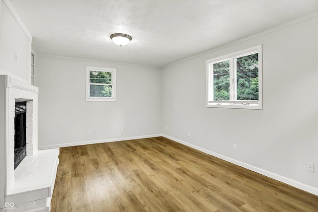 1065 Chevy Chase Ln, Carmel, IN 46280 - unfurnished living room with a fireplace, wood finished floors, and crown molding