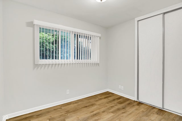 1065 Chevy Chase Ln, Carmel, IN 46280 - unfurnished bedroom featuring wood finished floors and a closet