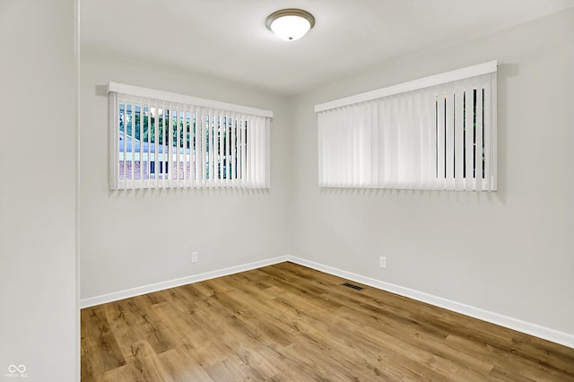 1065 Chevy Chase Ln, Carmel, IN 46280 - spare room featuring baseboards and wood finished floors