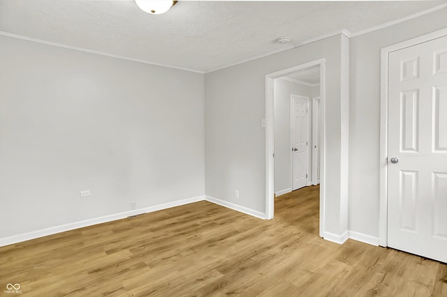 1065 Chevy Chase Ln, Carmel, IN 46280 - empty room with crown molding, light wood-style floors, and a textured ceiling