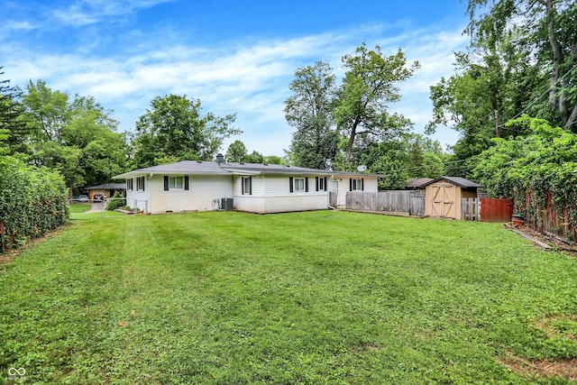 1065 Chevy Chase Ln, Carmel, IN 46280 - back of house with a fenced backyard and a shed