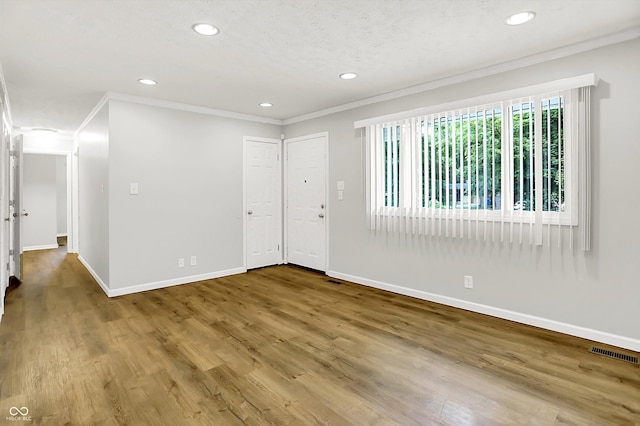 1065 Chevy Chase Ln, Carmel, IN 46280 - unfurnished room featuring crown molding, recessed lighting, and wood finished floors