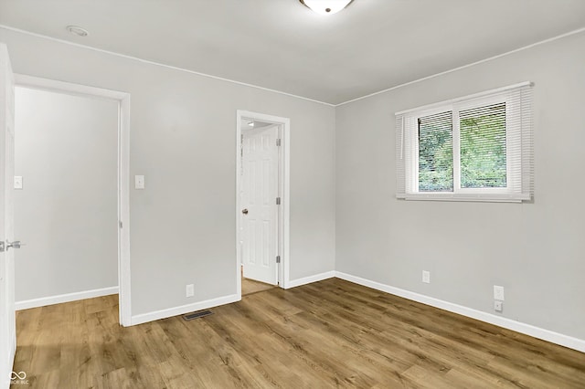 1065 Chevy Chase Ln, Carmel, IN 46280 - empty room featuring baseboards and wood finished floors