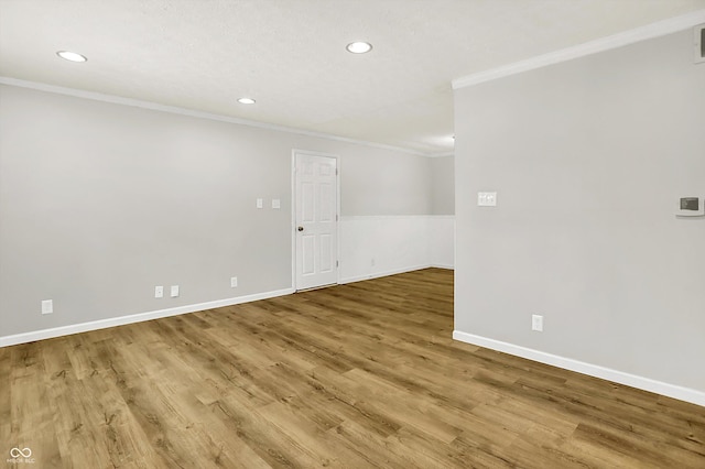 1065 Chevy Chase Ln, Carmel, IN 46280 - spare room featuring ornamental molding, recessed lighting, and wood finished floors