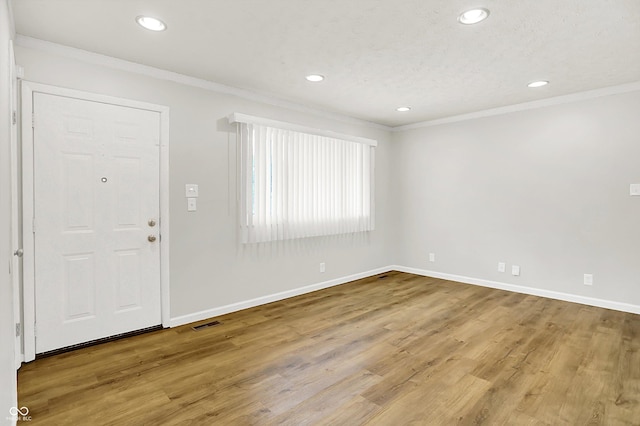 1065 Chevy Chase Ln, Carmel, IN 46280 - entrance foyer with ornamental molding, recessed lighting, and wood finished floors