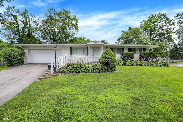 1065 Chevy Chase Ln, Carmel, IN 46280 - single story home featuring an attached garage, driveway, a front lawn, and covered porch